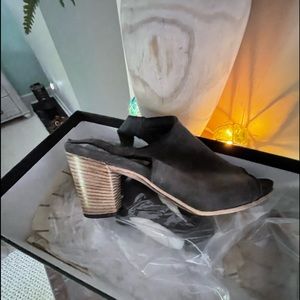 Suede open-toe sandal, buckle ankle closure with a wooden heel. Worn once.